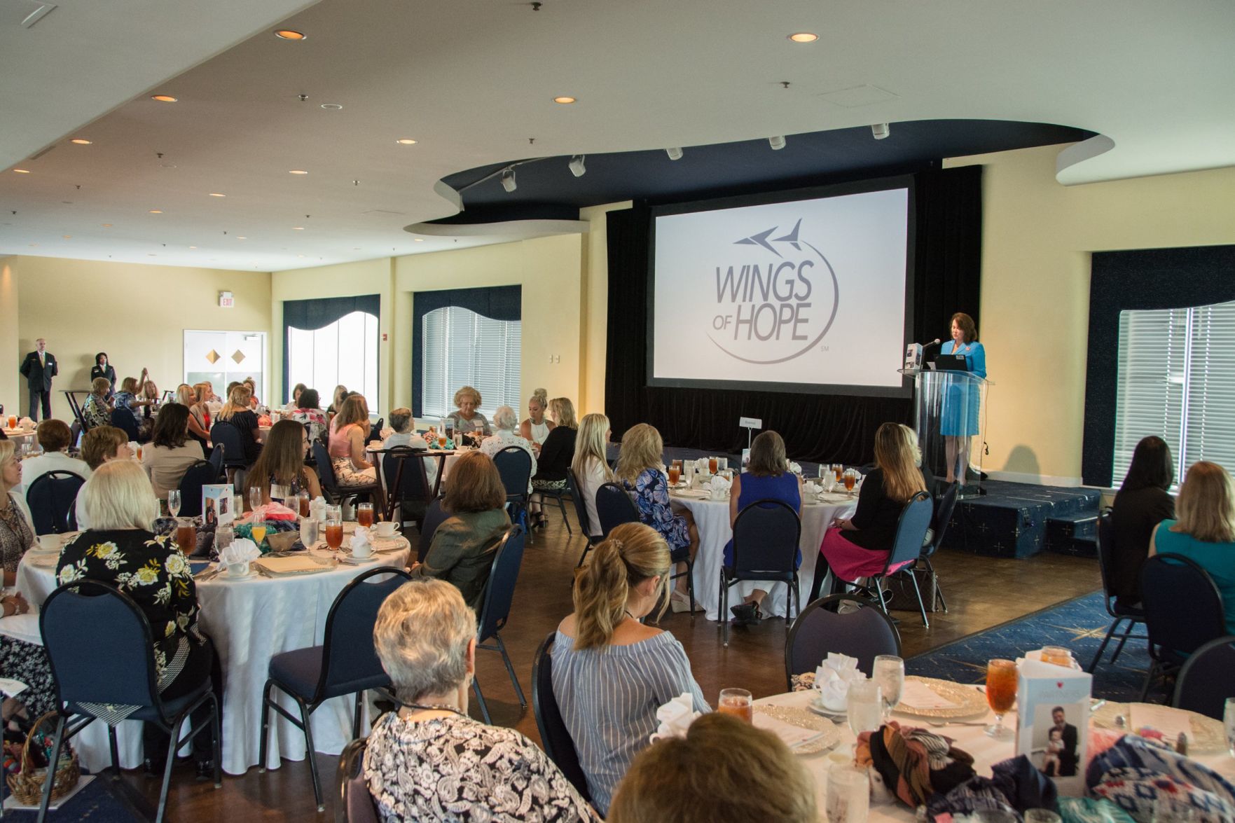Laura Helling, Vice-President of Wings of Hope gives an introduction to the event